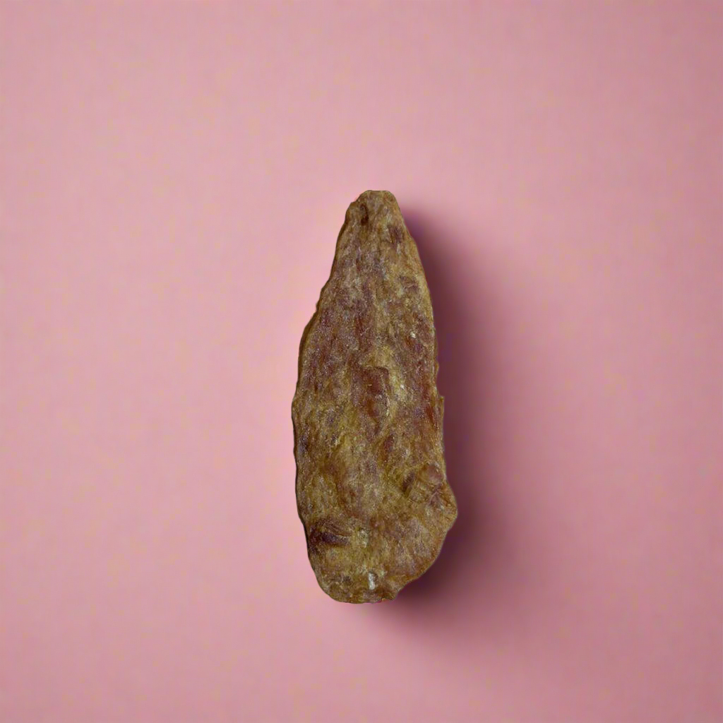 Thin dried strips of chicken jerky, laid flat