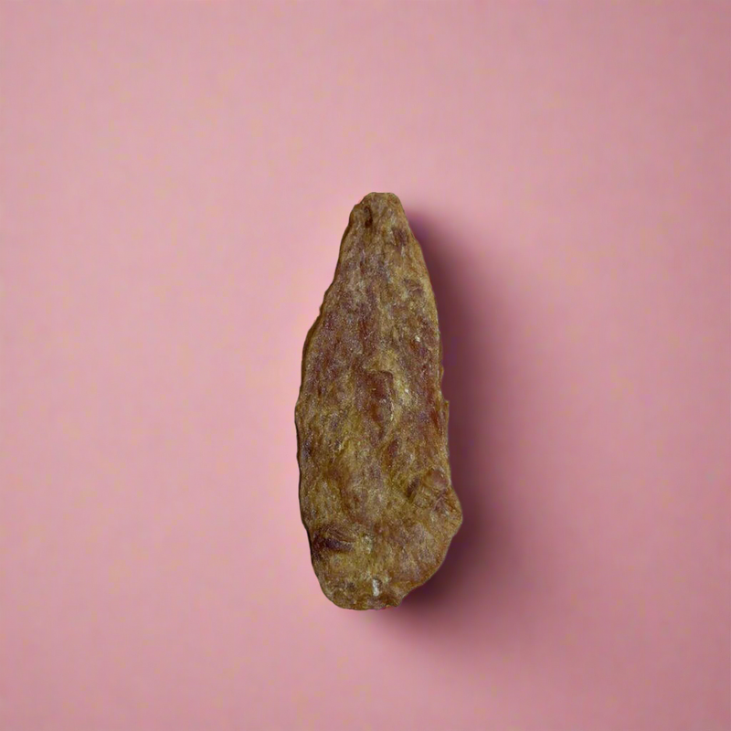 Thin dried strips of chicken jerky, laid flat