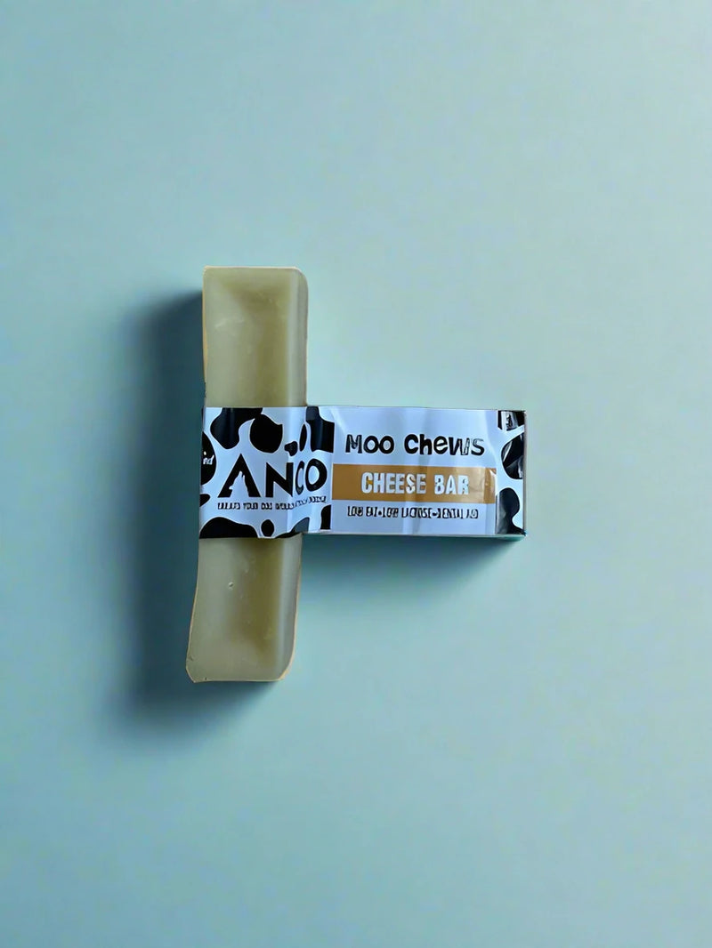 A large pale block of hard pressed yak milk chew, laid flat