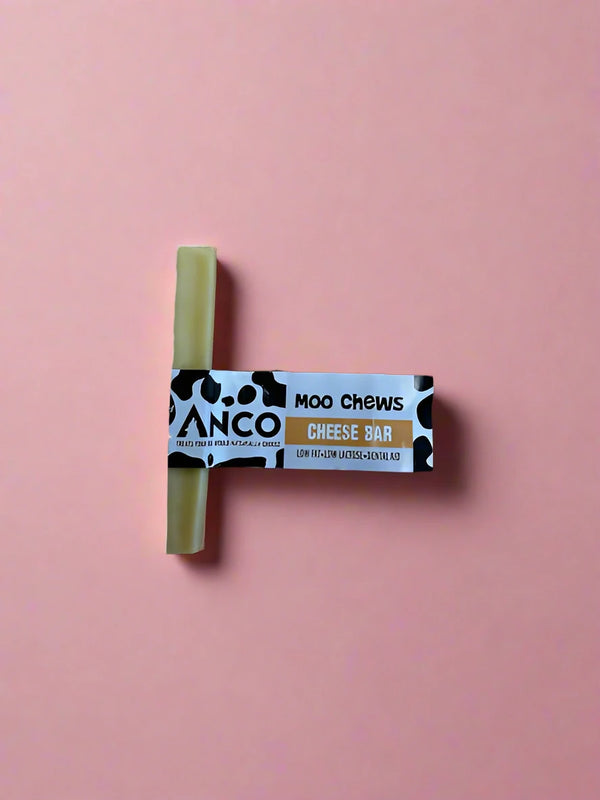 A small pale block of hard pressed yak milk chew, laid flat