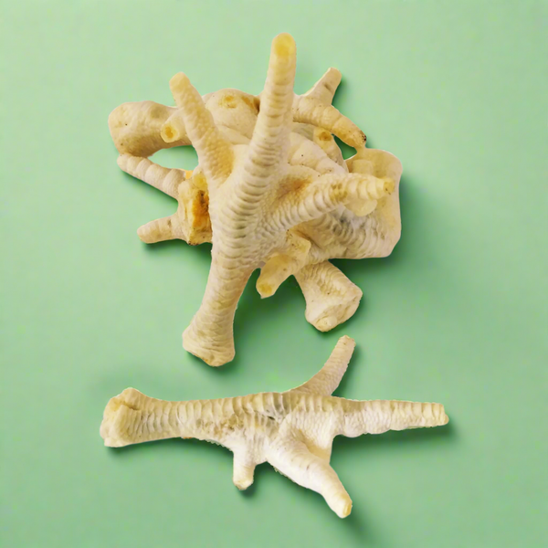 Puffed chicken feet, pale and light with the toes intact, laid flat
