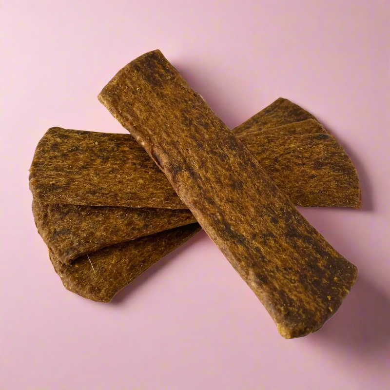 Strips of dried beef for dogs, laid flat