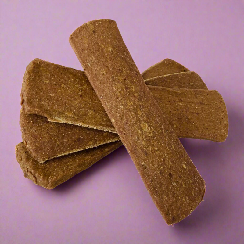 Strips of dried chicken for dogs, laid flat