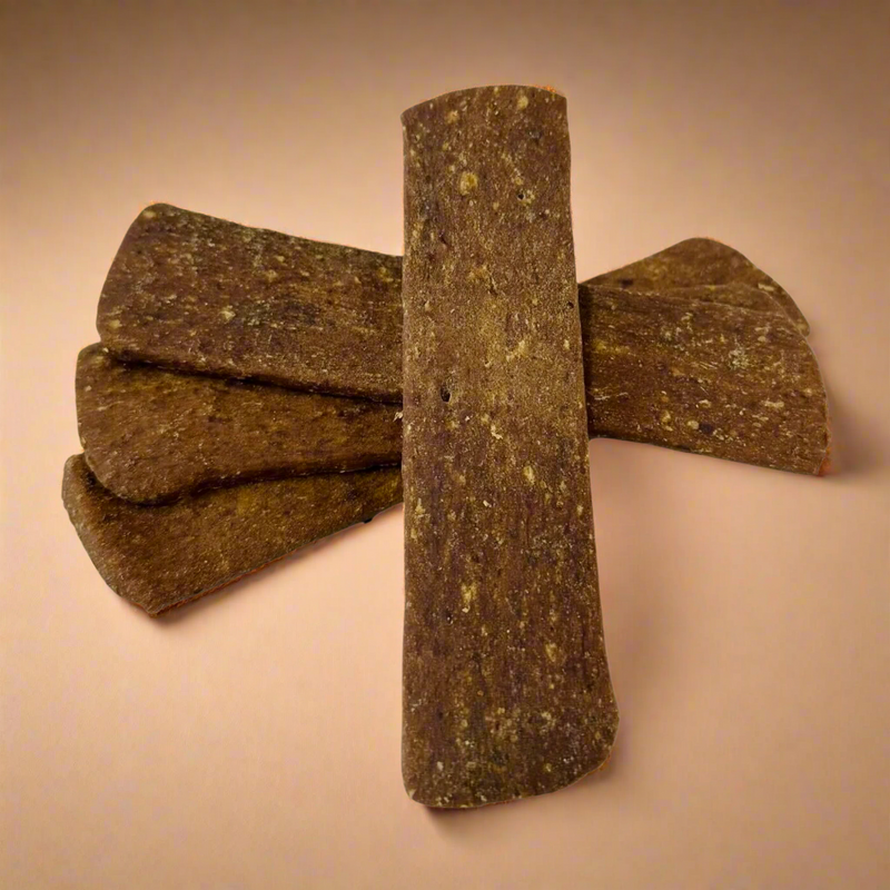 Strips of dried venison for dogs, laid flat