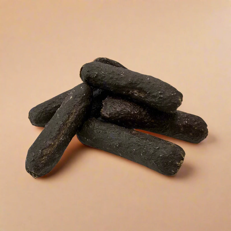 Small black pudding sausages for dogs, laid flat