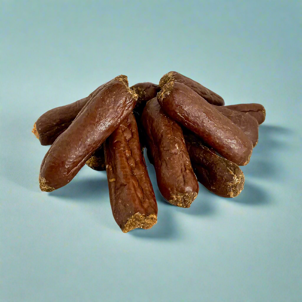 Small venison sausages for dogs, laid flat