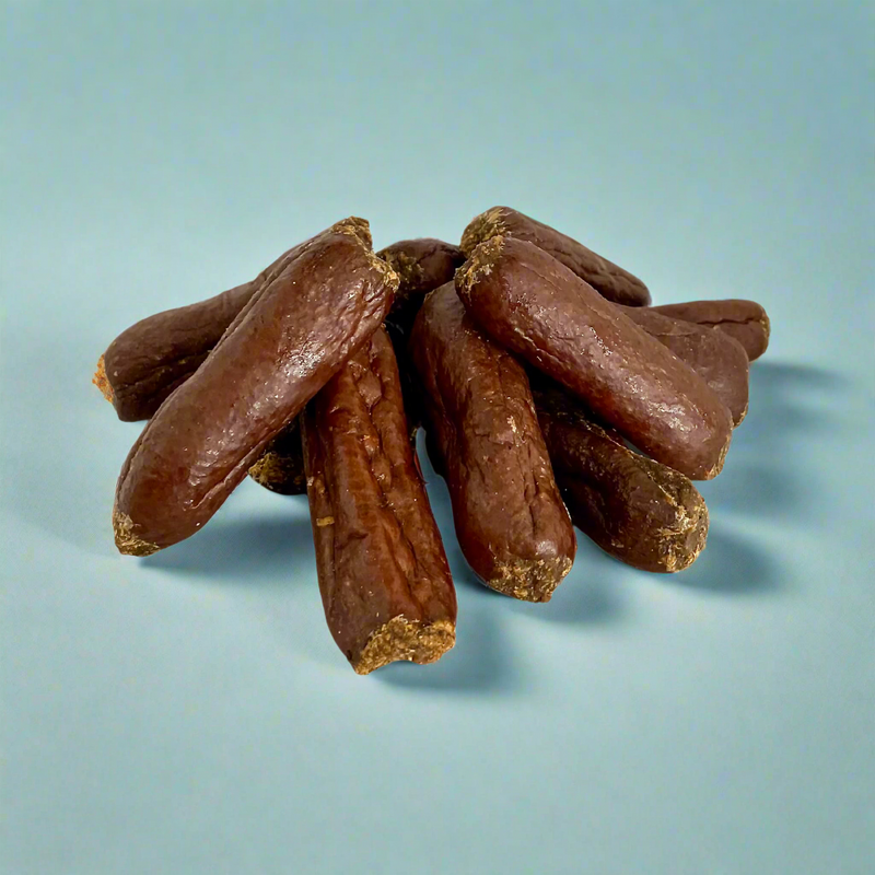 Small venison sausages for dogs, laid flat