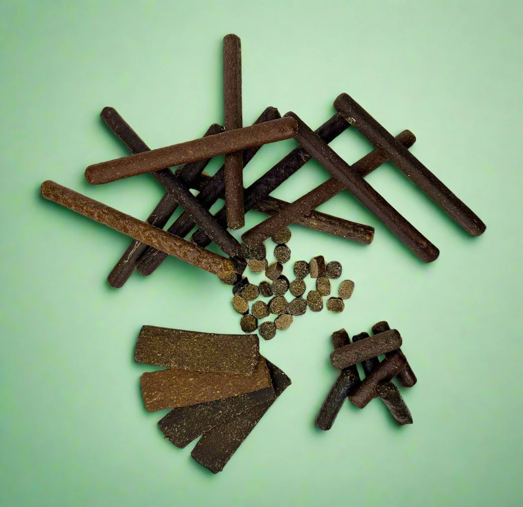 A PawsOn cardboard treat box packed with soft natural chews, shown from another angle