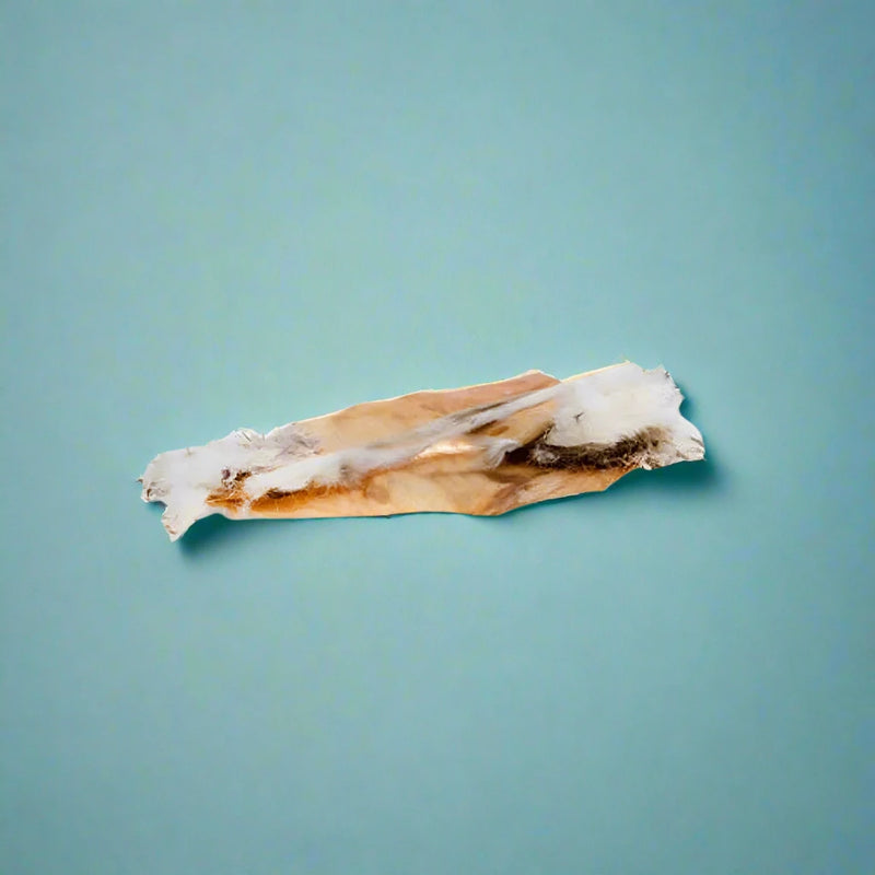 Strips of dried rabbit skin with the fur still attached, laid flat